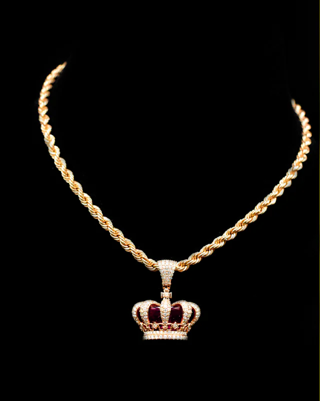 Gold rope chain with an iced crown pendant